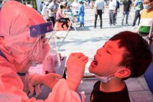 China's worst surge of coronavirus infections in months has spread to 14 provinces. By STR (AFP)