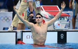 China's Wang Shun celebrates after winning the final of the men's 200m individual medley. By Oli SCARFF (AFP)
