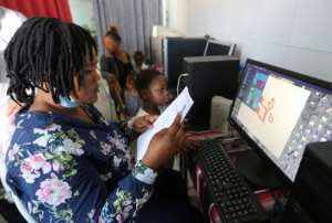 Computer classes are also offered to the migrants, many of whom originate from sub-Saharan Africa. By FATHI NASRI (AFP)