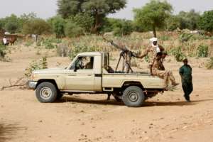 Conflict in Sudan's Darfur left the vast western region awash with weapons and divided by bitter rivalries; this 2006 photograph shows Sudanese security forces deploying during a rally. By ASHRAF SHAZLY (AFP/File)