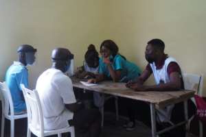 Consultation: ASCOVIME doctors talk to patients in Nkongsamba. Health services are sketchy and life expectancy is low in many parts of Cameroon. By Adrien MAROTTE (AFP)