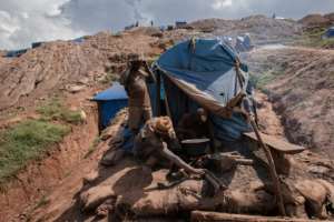 Close to 200 families have set themselves up near the mine, living in makeshift wooden structures covered with blue tarpaulin. By Guerchom NDEBO (AFP)