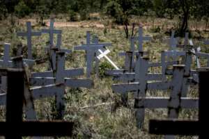 Crosses are planted on a hillside at the White Cross Monument, each one marking a white farmer killed in a farm murder in Ysterberg. By GULSHAN KHAN (AFP/File)