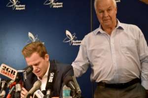 Cricketer Steve Smith (L) is comforted by his father Peter as he reacts at a press conference at the airport in Sydney on March 29, 2018, after returning from South Africa. Distraught Australian cricketer Steve Smith on March 29 accepted full responsibility for a ball-tampering scandal that has shaken the sport, saying he was devastated by his 