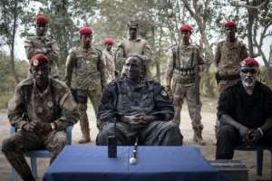 Darbada with some of his security personnel at the base of his move to Bokolobo. By FLORENT VERGNES (AFP / File)