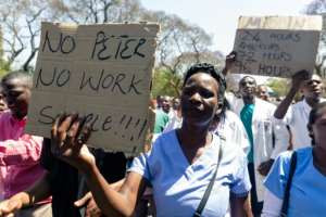 Demonstrator believe Dr Peter Magombeyi was taken because of his role in organising strikes to demand better pay and working conditions. By Jekesai NJIKIZANA (AFP)