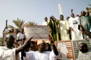 Demonstrators in Senegal hold up a placard reading 'Gays, lesbians, bisexuals, transgenders - out' in a 2016 protest. By MOUSSA SOW (AFP/File)