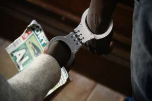 Defendants stand handcuffed together at a special session at the Kampala High Court. Some of the victims had waited as many as seven years to see their attackers go on trial. By Isaac Kasamani (AFP/File)