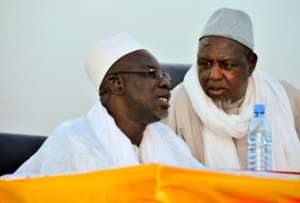 Dicko pictured right in 2015, told the crowd jihadism had no place in Mali. By HABIBOU KOUYATE (AFP/File)