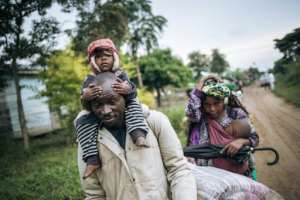 Displaced people flee an alleged ADF attack last year at Halungupa, a village in Beni province. By Alexis Huguet (AFP/File)