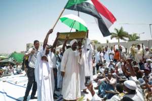 Dressed in white traditional clothes, men and women headed to the military complex on Friday to join thousands of others camped there. By MOHAMMED HEMMEAIDA (AFP)