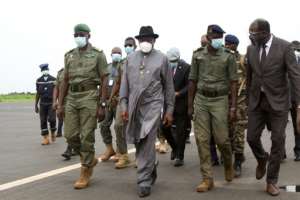 ECOWAS mediator and ex-Nigerian President Goodluck Jonathan, centre wearing hat, in Mali earlier this month for talks with the junta. By ANNIE RISEMBERG (AFP/File)