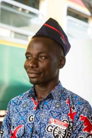 Ebenezer Boadu prepares to welcome passengers aboard the train. By RUTH MCDOWALL (AFP)