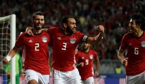 Egypt defenders Baher El-Mohamady (L) celebrates with his Ahmed Elmohamady (C) and Ahmed Hegazi (R) after scoring a goal during the Africa Cup of Nations qualifier football match against Tunisia near Alexandria November 16, 2018. By KHALED DESOUKI (AFP/File)
