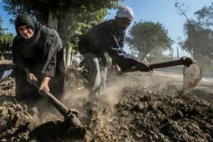 Egyptian farmers Zannuba Mohammed and her husband Karam Shaaban work in their farm which gets its irrigation water from a canal, supplied by the Nile river, which provides 97 percent of the country's water supply. By Khaled DESOUKI (AFP)