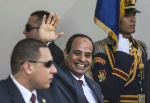 Egypt's President Abdelfattah al-Sisi at a ceremony for the opening of a second lane and widening of the Suez Canal in August 2015, a project that cost over $8 billion. By KHALED DESOUKI (AFP)