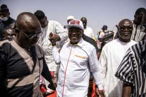 Eddie Komboigo (c) is standing for the party of former president Blaise Compaore. By OLYMPIA DE MAISMONT (AFP)