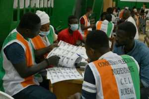 Electoral commission officials check the voters' roll on Saturday. By Issouf SANOGO (AFP)