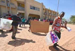 Election workers heading for a polling station in Ouagadougou on Saturday to set up the ballot boxes. By Issouf SANOGO (AFP)