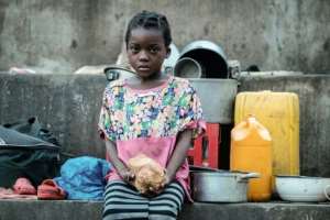 Elena Joaquin, 6, sits in a shelter in Buzi, Mozambique.  By Yasuyoshi CHIBA (AFP)
