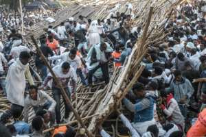 Emergency vehicles struggled to part the crowd to enter the site and take victims to the hospital. By EDUARDO SOTERAS (AFP)