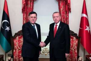 Erdogan (L) met Fayez al-Sarraj, the head of the Tripoli-based Government of National Accord, in November. By Mustafa Kamaci (TURKISH PRESIDENTIAL PRESS SERVICE/AFP/File)