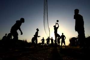 Ethiopian refugees who fled fighting in Tigray province play volleyball at the Um Raquba camp. By ASHRAF SHAZLY (AFP)