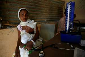 Ethiopian refugees who fled fighting in Tigray receive medical care at the Um Raquba camp in eastern Sudan. By ASHRAF SHAZLY (AFP)