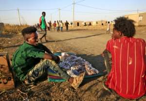 Ethiopian refugees who had savings quickly bulk-bought food and other goods that they can sell after fleeing into Sudan. By ASHRAF SHAZLY (AFP)