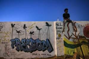 Even though Sudanese graffiti artists enjoy their first freedom shot, they all complain about the lack of equipment. By OZAN KOSE (AFP / File)