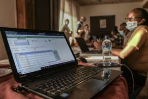 Experts from the Kenya Wildlife Service and the government analyse data collected during aerial wildlife aerial counts. By Tony KARUMBA (AFP)