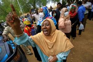 Family members of the accused rally against the trial outside the courthouse. By ASHRAF SHAZLY (AFP)