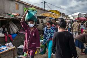 Facemasks, herbs and spices: Ambodivona has been even busier than usual since President Andry Rajoelina announced confinement measures, prompting the market to close every day at noon. By RIJASOLO (AFP)