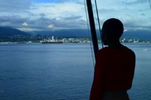 Faridah watches the port of Vancouver during her visit to Canada for the conference. By Alia DHARSSI (Safer Cities / AFP)