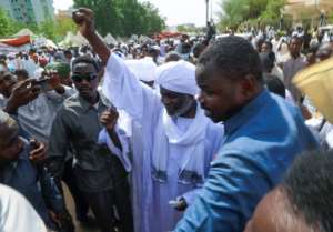 Finance Minister Gibril Ibrahim -- an ex-rebel leader from Darfur, who joined the government after a landmark 2020 peace deal -- took part in Friday prayers at the pro-military sit-in. By ASHRAF SHAZLY (AFP)