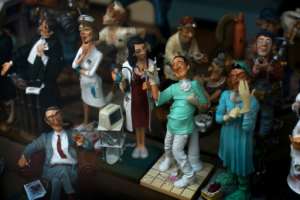 Figurines depicting medical personnel are displayed in the showcase of a store in Ronda, Spain. By JORGE GUERRERO (AFP)