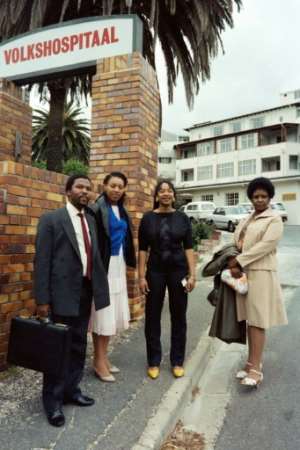 File picture from November 1985 at the height of the apartheid era: Winnie Madikizela-Mandela with her daughters Zenani, centre, and Zindzi, left, visiting Nelson Mandela after he underwent surgery in a Cape Town hospital. By Gideon Mendel (AFP)