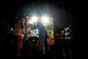 Firefighters and paramedics transport a suspected COVID-19 patient in Glen Burnie, Maryland. By Alex Edelman (AFP)