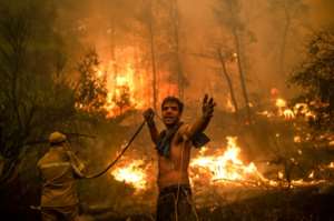 Fires during heatwaves which experts have linked to climate change have caused much damage in parts of Europe and the United States. By ANGELOS TZORTZINIS (AFP/File)