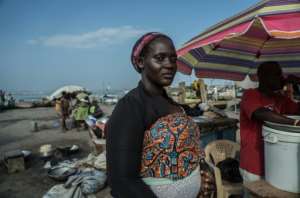 Mercy Allotey, a fish seller, says the catches of local fishermen have been getting smaller and smaller. By Natalija Gormalova (AFP)