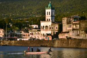 Fishermen return to harbour in Moroni, capital of the volcanic Comoros archipelago.  By TONY KARUMBA (AFP)