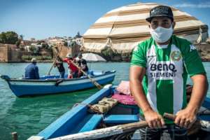 For decades, the boatmen have used elbow grease to ply their trade, rowing their bright blue boats, decked out with cushions and carpets and shaded by parasols, across the river. By FADEL SENNA (AFP)