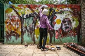 For years, graffiti in Sudan has remained clandestine despite censorship imposed by unarmed security guards. By OZAN KOSE (AFP / File)