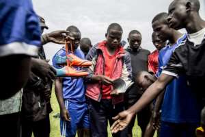 Former Democratic Liberation Forces of Rwanda fighters prepare to play football at Mutobo's reintegration centre -- but reconciliation attempts cannot hide the fact 1,012 international arrest warrants are out for suspects in 32 countries. By JACQUES NKINZINGABO (AFP/File)