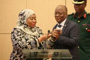 Former president John Magufuli and his then deputy, Samia Suluhu Hassan, pictured in July 2019. By Ericky BONIPHACE (AFP/File)