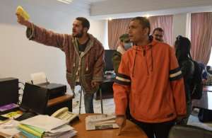 Former Tunisian protesters who were injured during the revolution demand recognition and compensation in the capital Tunis. By FETHI BELAID (AFP)