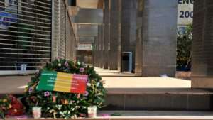 Flowers laid at the entrance to the Radisson Blu hotel in Bamako in 2015, in tribute to the victims of the deadly terrorist attack. By HABIBOU KOUYATE (AFP/File)