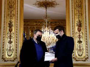 French President Emmanuel Macron (R) meets in January at the Elysee Palace with historian Benjamin Stora for a report on France's colonisation of Algeria and the Algerian War for independence.. By CHRISTIAN HARTMANN (POOL/AFP)
