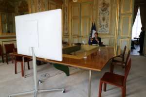 French President Emmanuel Macron speaks by videoconference with World Health Organization chief Tedros Adhanom Ghebreyesus at the Elysee Palace on April 8, 2020. By Ludovic MARIN (POOL/AFP/File)