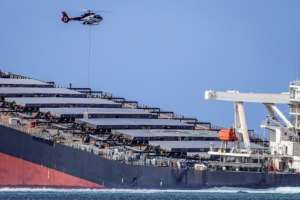 Fuel was being airlifted by helicopter to the shore before a barge was able to approach the ship and safely pump out 500 tonnes. By Daren Mauree (L'Express Maurice/AFP)